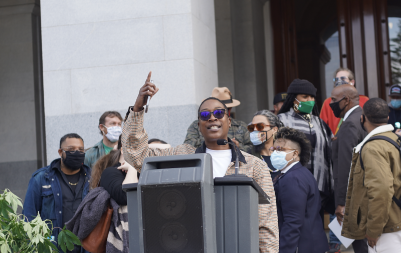 Chaney Turner speaks in front of California's State Capitol Building in Sacramento during a protest of high cannabis taxes in January of this year.