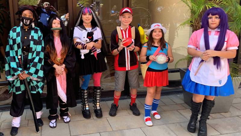 Concord Comic Con attendees show off their cosplay outfits of characters from Demon Slayer (Tanjiro Kamado; Nezuko Kamado), Danganronpa (Ibuki Mioda, Mikan Tsumiki), and Pokémon (Red; a Pokémon trainer).