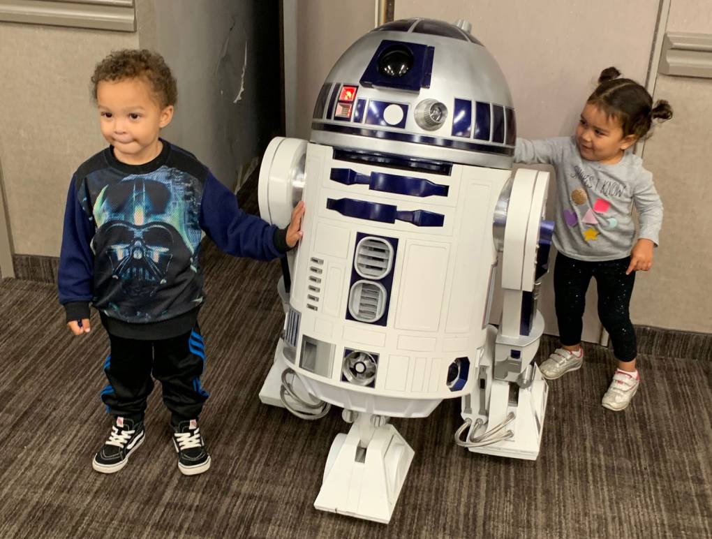 Youngsters pose with R2D2 at Conta Costa Con.