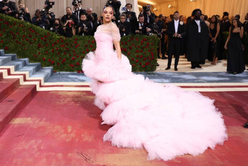 Tessa Thompson wearing a pale pink dress with sculpted bodice and skirt and layered train.