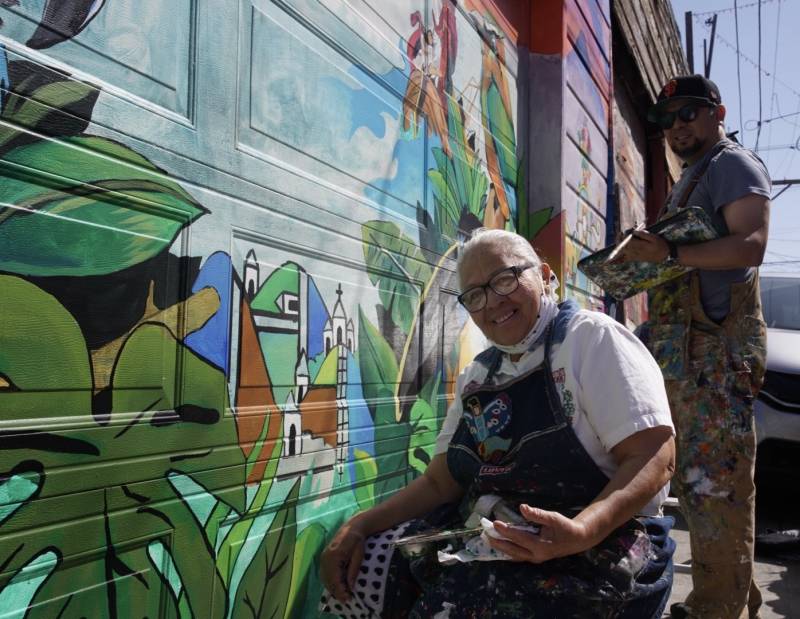 Ester and her son Josué Rojas painting in SF's Balmy Alley.