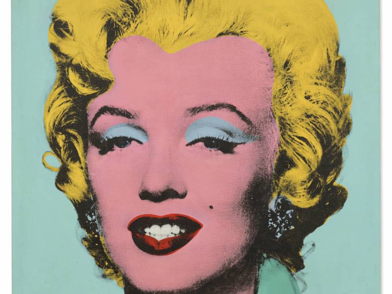 Marilyn Monroe's face, rendered in bright yellow, pink, red and turquoise by Andy Warhol.