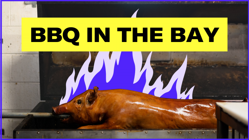 A whole roast pig on a rotisserie spit with an illustration of blue flames emerging from behind it. The text above reads, "BBQ in the Bay."
