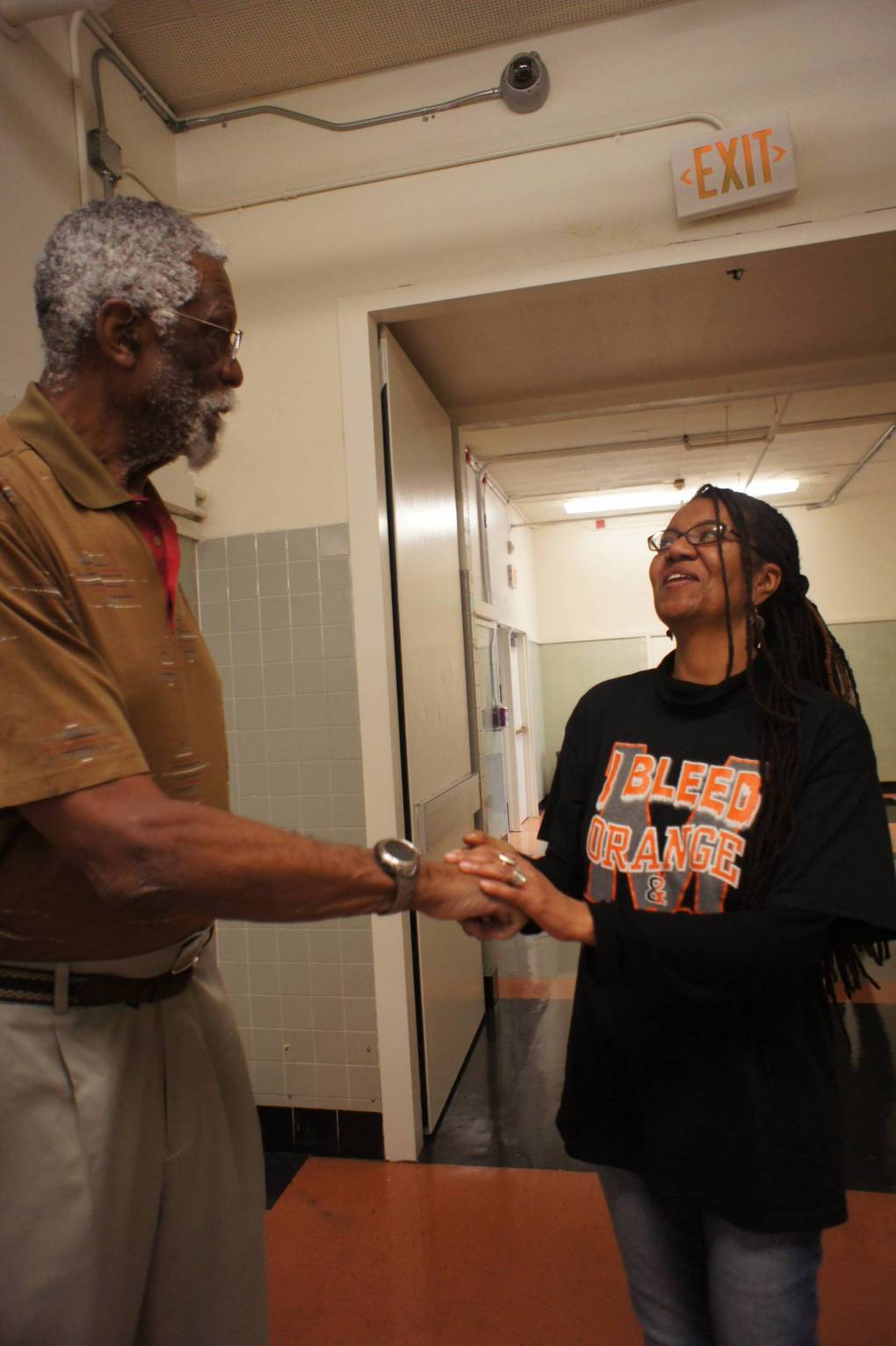 Artist and educator Rose Marr meeting Mr. Bill Russell for the first time.