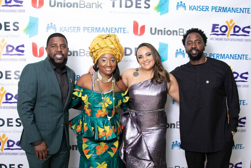 Adante Pointer, Queen Imïnah, Selena Wilson and Akintunde Ahmad stand shoulder to shoulder at a prior EOYDC gala.