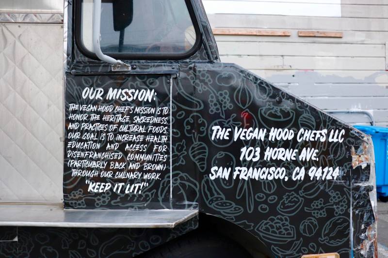 one side of the Vegan Hood Chefs' truck shares their mission, which is to honor the heritage, sacredness and practices of cultural foods