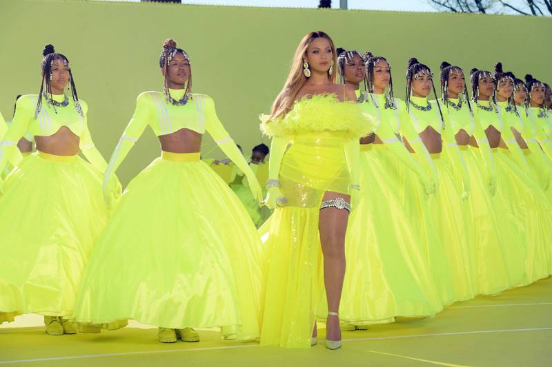 Beyoncé heads a formation of Black women, all wearing neon green gowns.