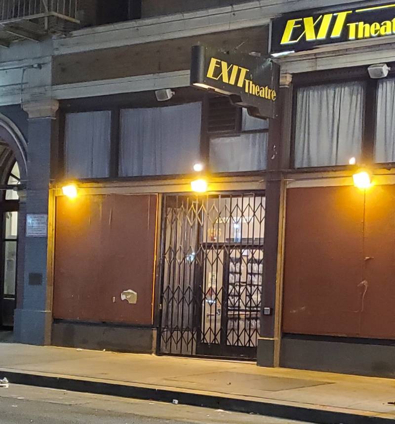 a shuttered venue with a sign that reads 'EXIT Theatre'