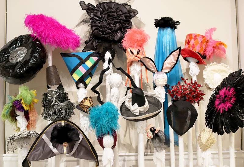 Colorful hats feature silk bunny ears, turquoise feathers, translucent veils and more.