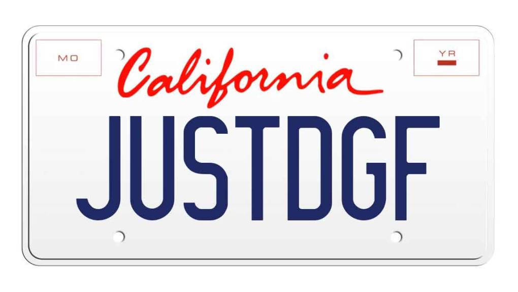 A rendering of a license plate reading "JUSTDGF"
