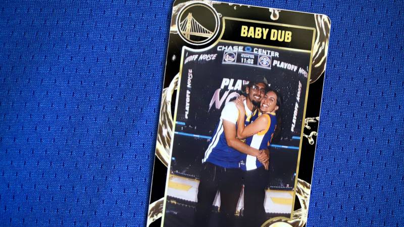 A trading card with a photo of the author and his wife at the Chase Center