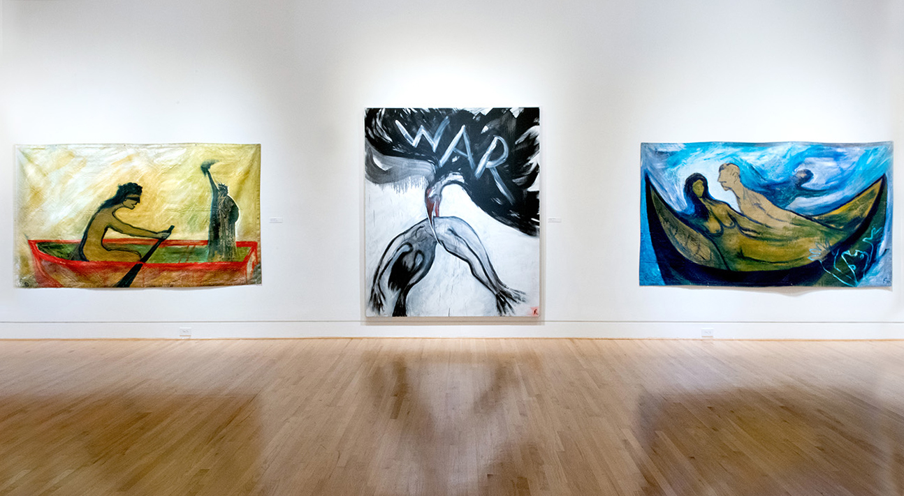 Three large paintings on white wall