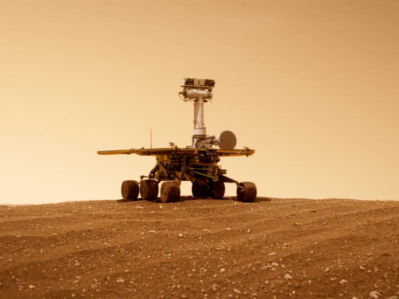 A Mars Rover robot explores the red planet.