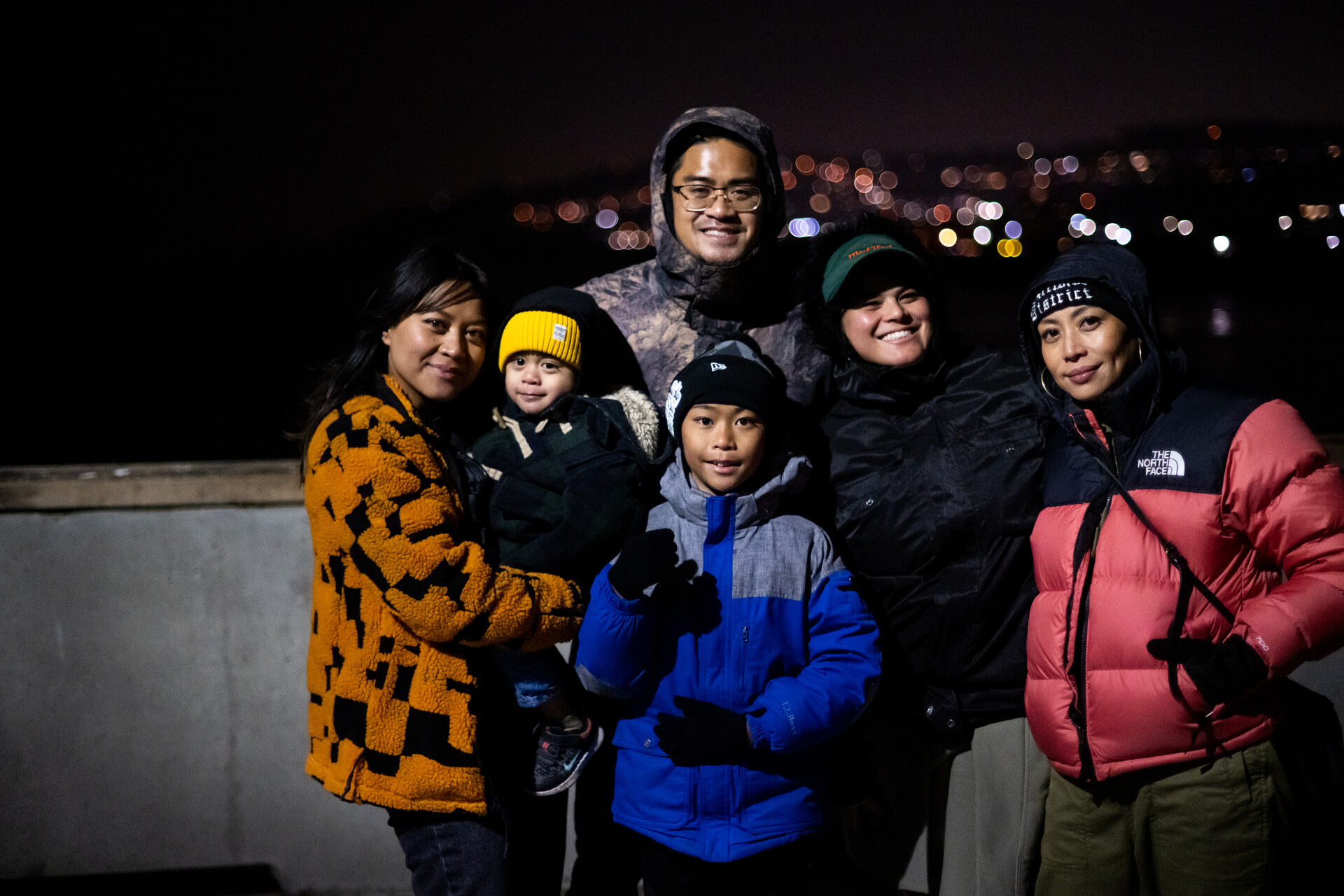 A nighttime family portrait taken on the pier in Pacifica.