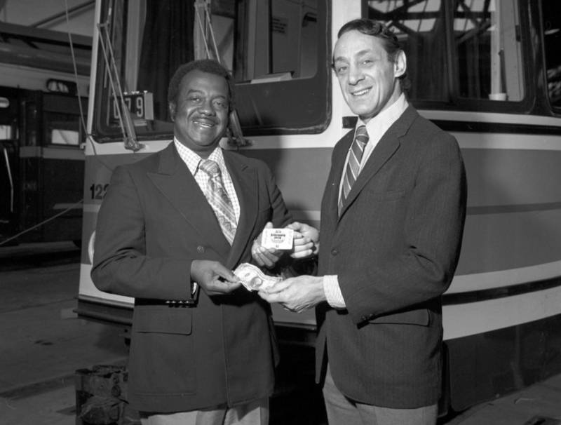 Curtis Greene and Harvey Milk introduce the MUNI “Fast Pass” in 1978. (SFMTA’s online archive)