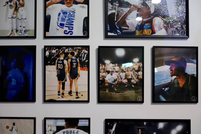 a wall of photos, featuring Jordan Poole of the Golden State Warriors