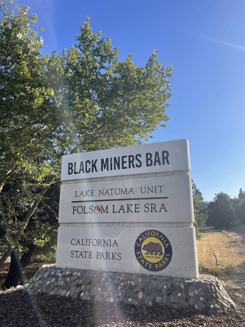 Black Miners Bar sign painted in summer of 2022.