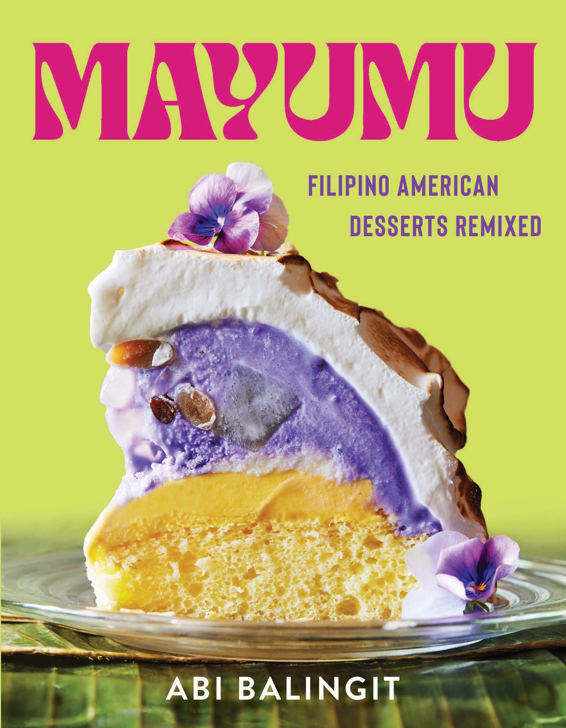 Cover of a cookbook with a photo of a slice of baked Alaska with ube ice cream on the inside. Text reads, "Mayumu, Filipino American Desserts Remixed."