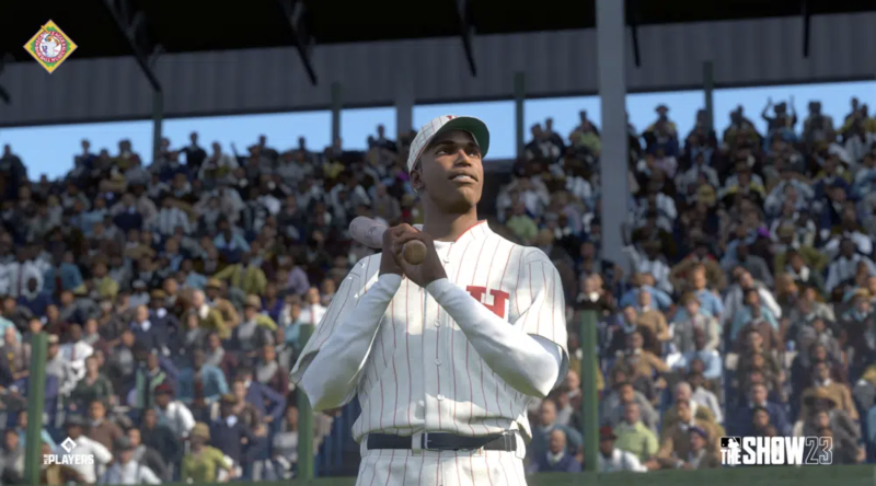 A digital rendering of a Black baseball player, wearing a crisp white uniform and cap, bat raised over his shoulder. Packed stands are visible behind him.