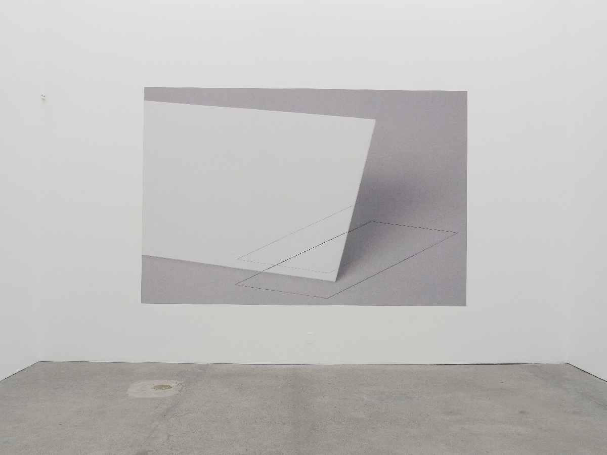 Large gray photograph of white shapes and lines adhered directly to white gallery wall