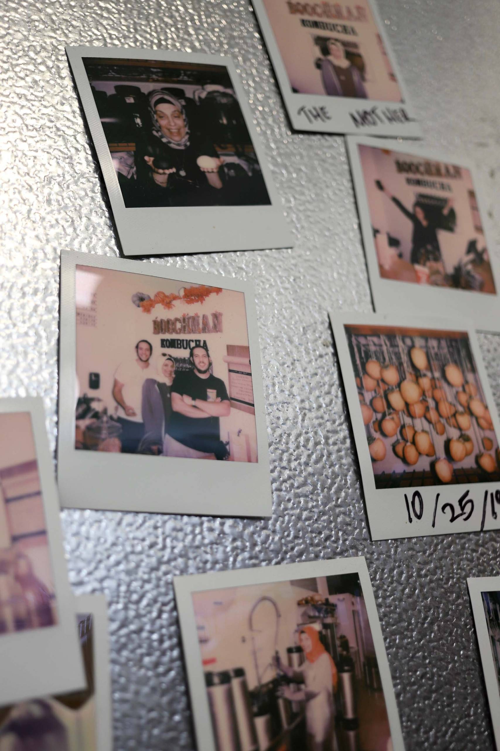 an array of Polaroid photographs showing Turkish family members at Boochman Kombucha in Berkeley