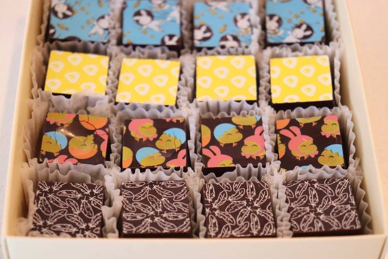 A tray of colorfully decorated chocolates at Kokak in San Francisco