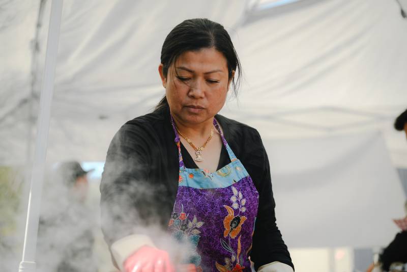 A Cambodian chef steams food