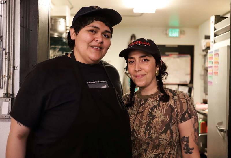 Two women foodmakers stand in an Oakland kitchen during their Palestinian food pop-up