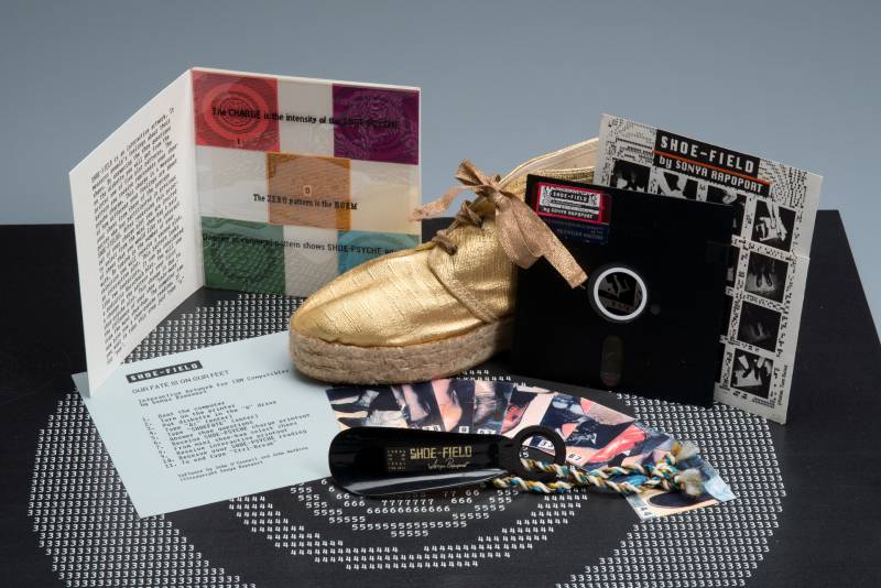 Collection of booklets, printed paper, floppy disk, gold shoe and shoehorn