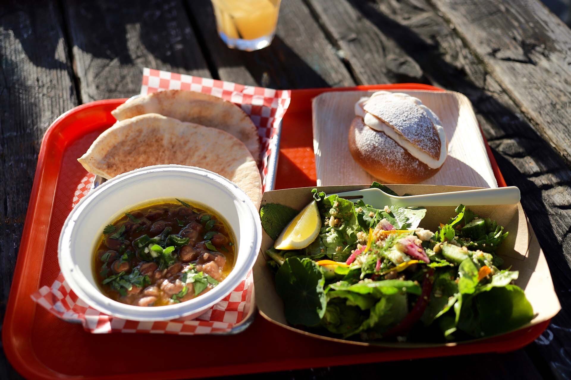 a tray of Palestinian food is served at an outdoor patio in Oakland