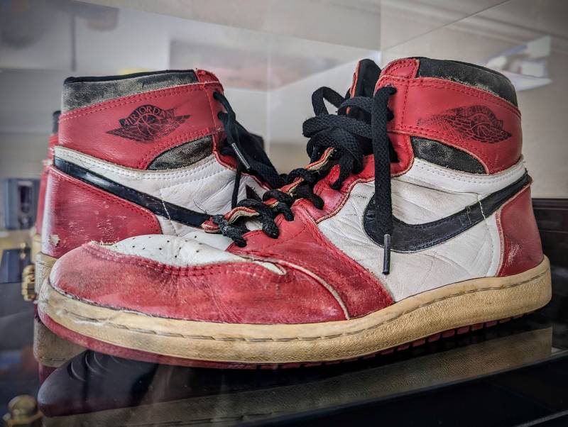 a pair of vintage red, white and black Nike Air Jordans