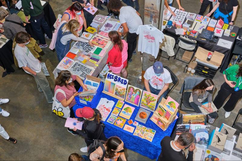 people gather at a book fair, scene in an aerial shot