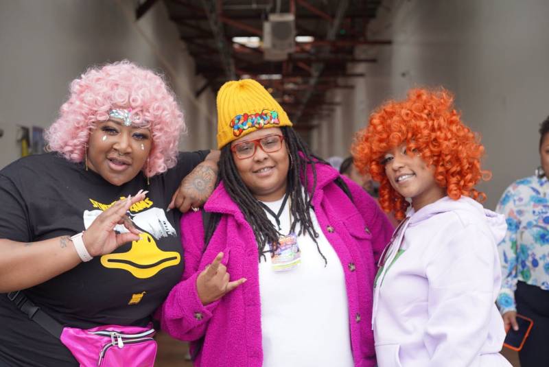 The Baby Mama Mafia, a group comprised of lyricist Beastella, DJ Ella Baker and rapper The Booth Fairy, pose for a photo.