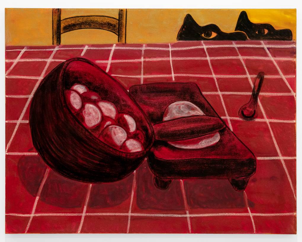 Two dogs peek over red tablecloth where bowl of dough sits next to a rolling pin and spoon