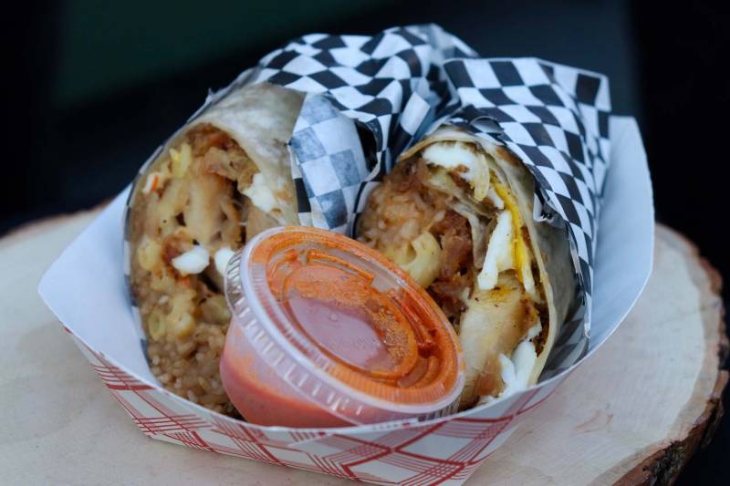 a fried chicken burrito with Hawaiian mac salad is on display