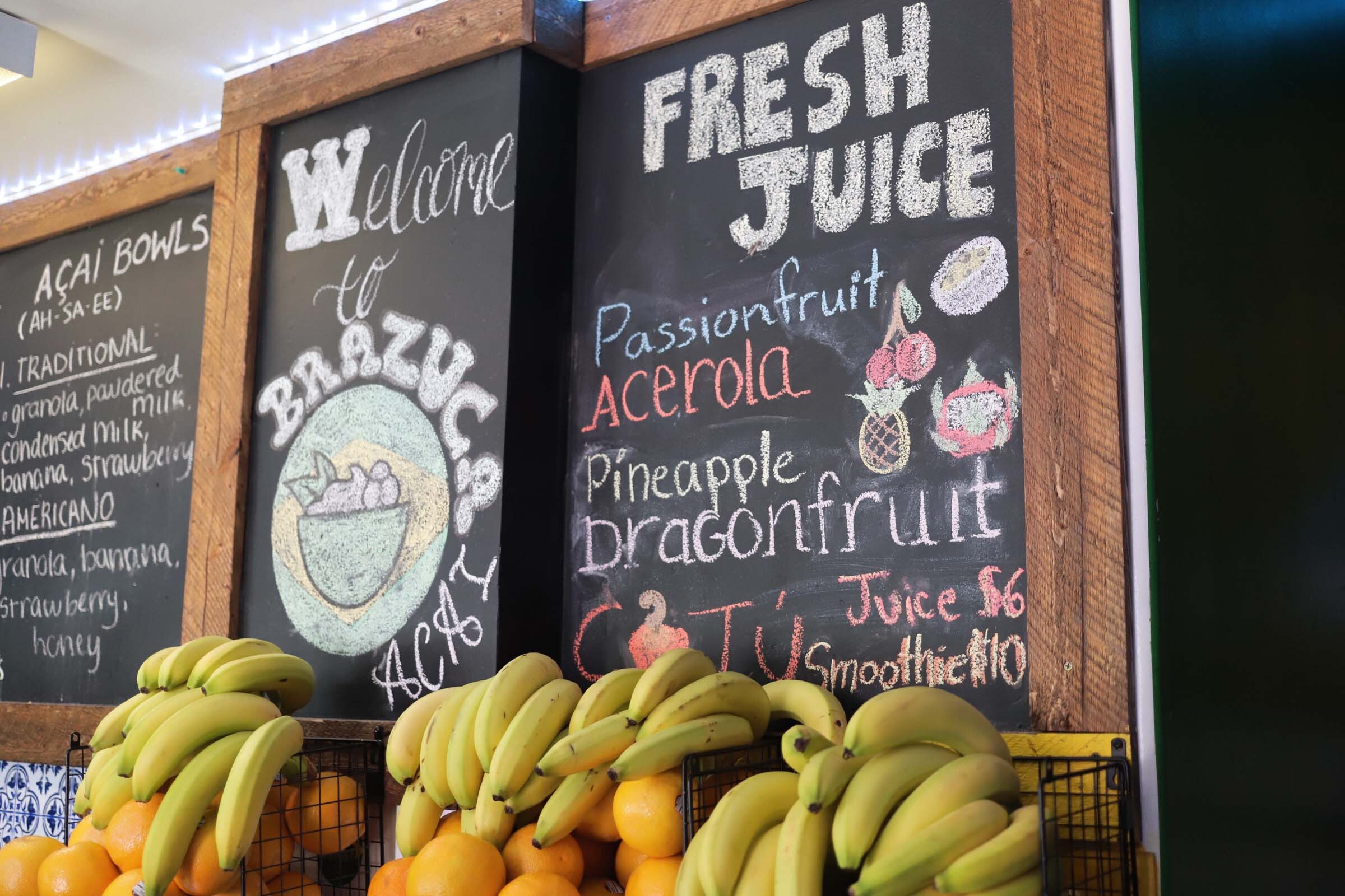 a menu of juice and smoothie options inside a Brazilian eatery in Richmond