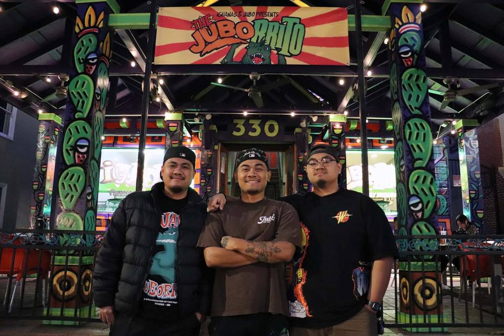 three brothers proudly stand in front of a taqueria in San Jose