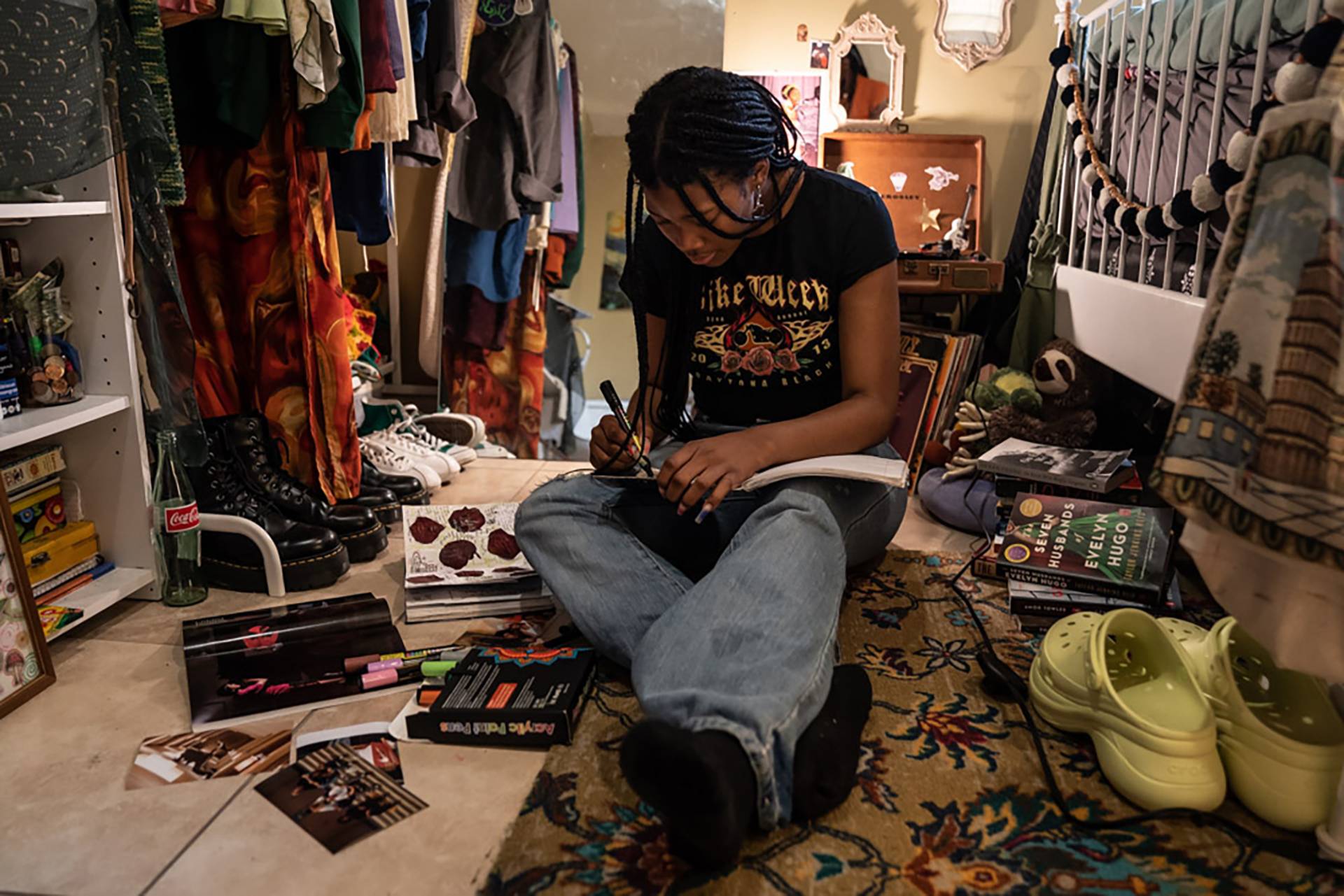 Makiyah Hicks, sits in her bedroom where she recorded her part of the podcast "Loss And Transformation."