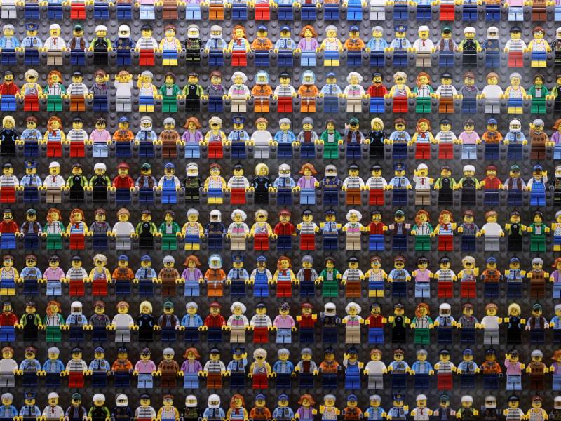 A wall of LEGO minifigures is encased inside the lobby of the LEGOLAND New York Hotel, pictured on Aug. 6 2021 in Goshen, New York. The Danish company is pledging to remove harmful stereotypes from its products and marketing.