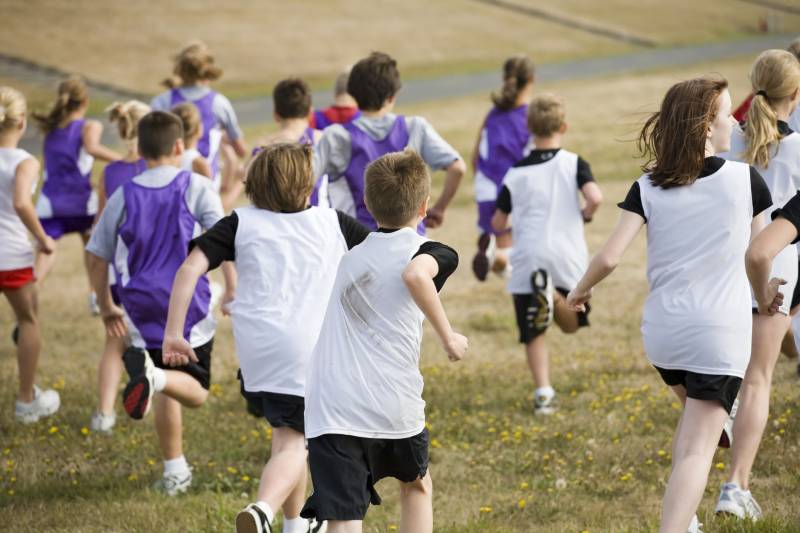 Students running on field