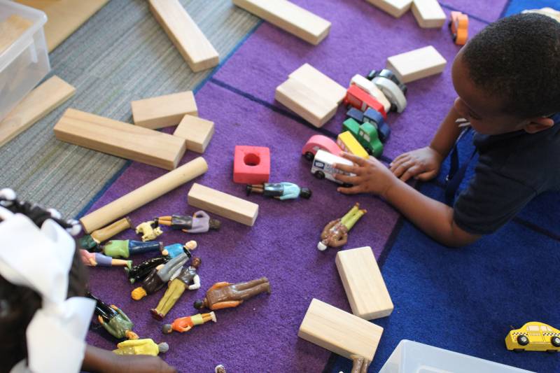 Two children play with blocks and other tools during a morning play session at Impact Salish Sea Elementary.