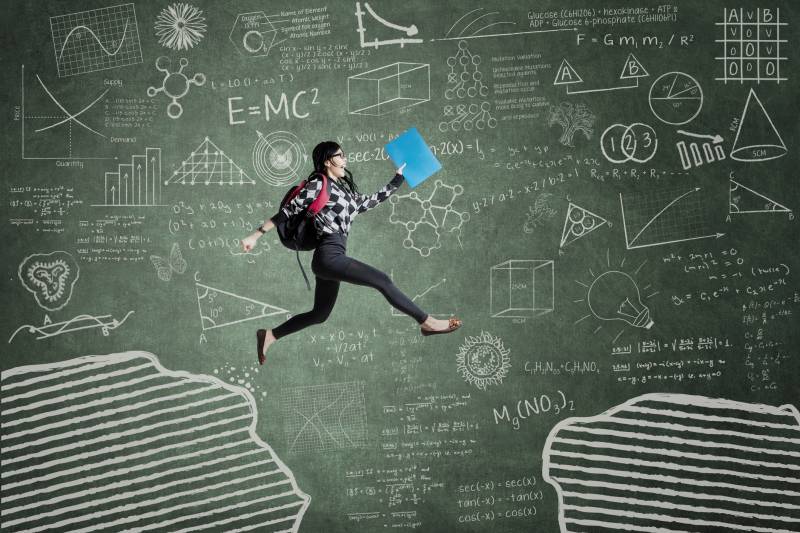 Female student jumping in classroom through gap on the blackboard illustration