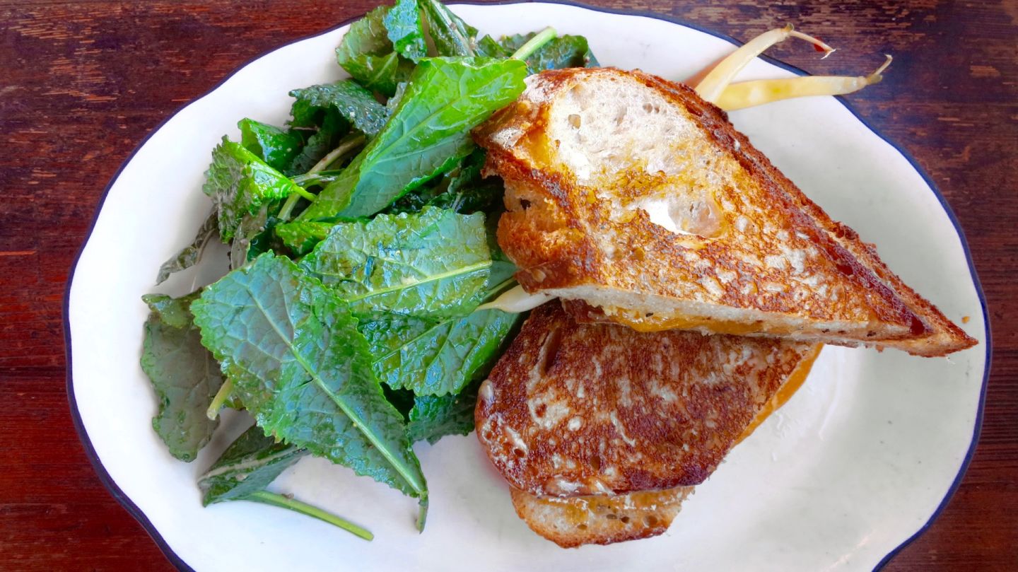 Grand Lake Kitchen's grilled cheddar cheese sandwich on sourdough is simple yet satisfying. Jenny Oh