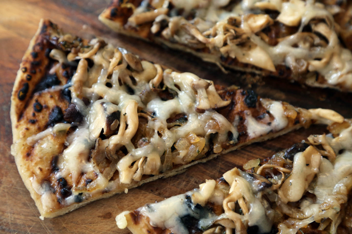 Grilled pizza with wild mushrooms, caramelized onions, and fontina Wendy Goodfriend
