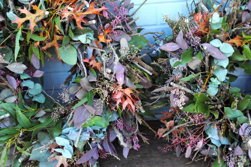 Give the gift of classic holiday flair with a wreath from one of CUESA's flower vendors.
