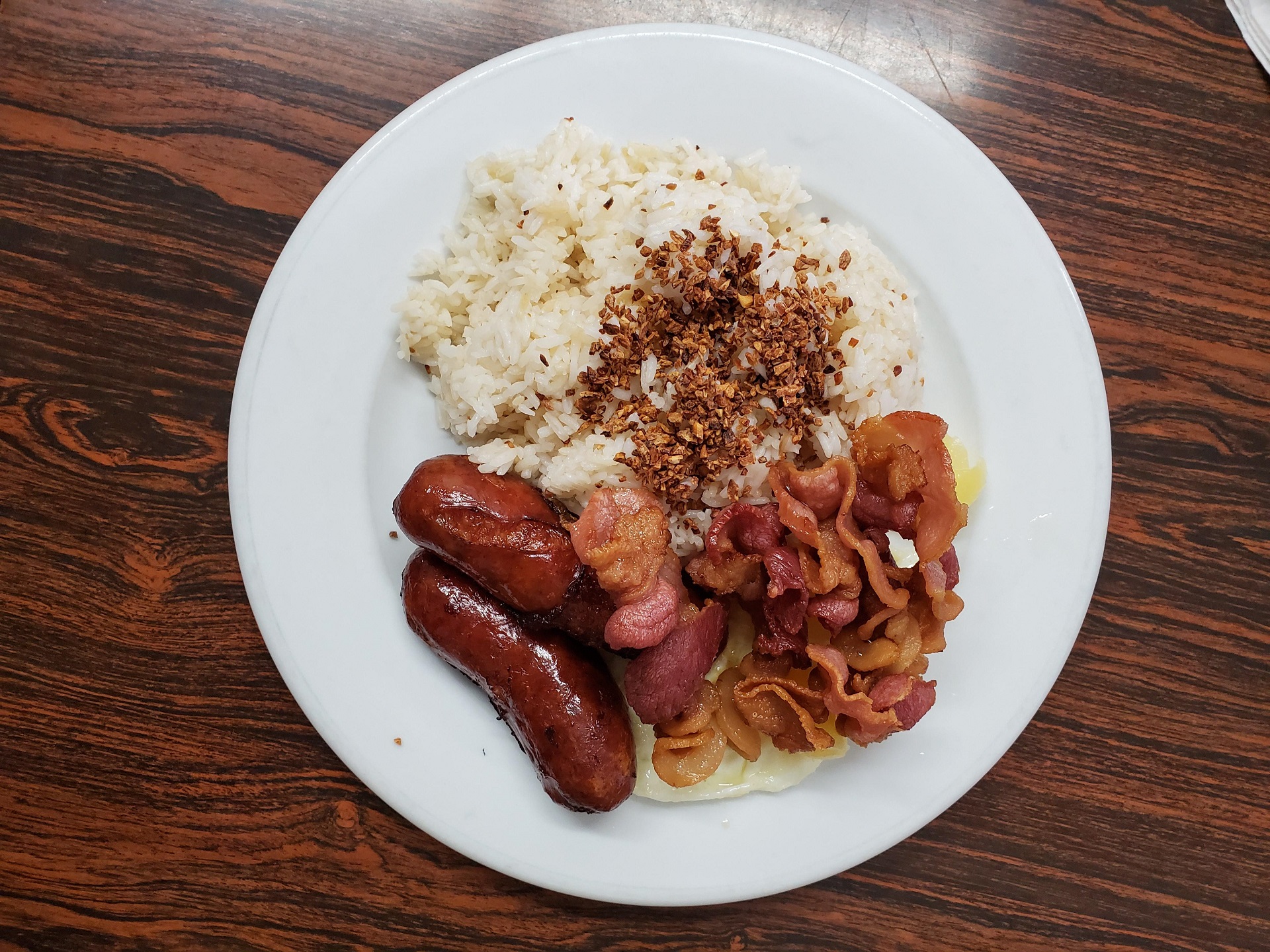 Gateway Kitchen's longanisa silog served with a side of bacon and garlic rice.