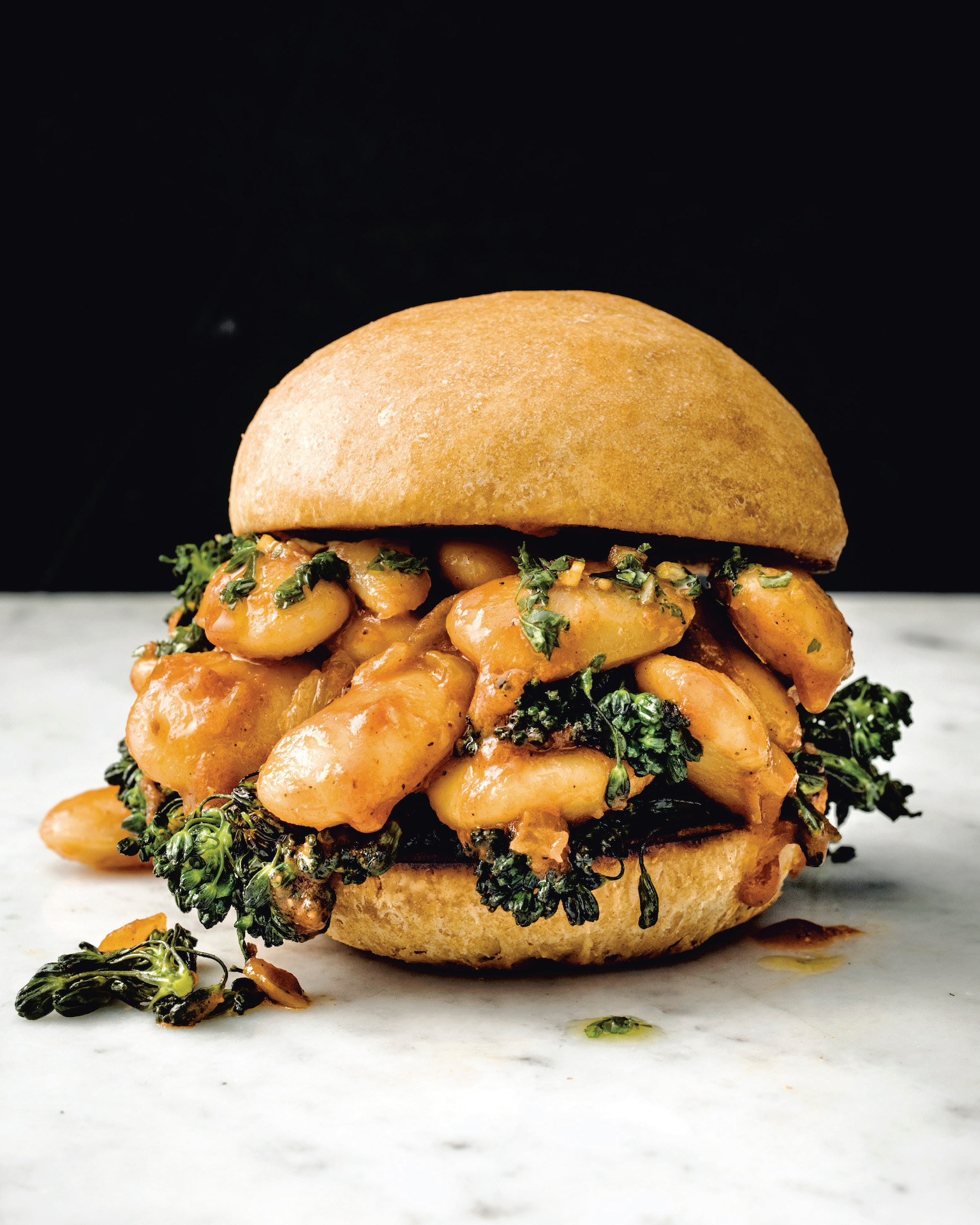 Chef Bryant Terry's big beans, buns and broccoli rabe rabe packs protein and texture between a teff and flour bun.