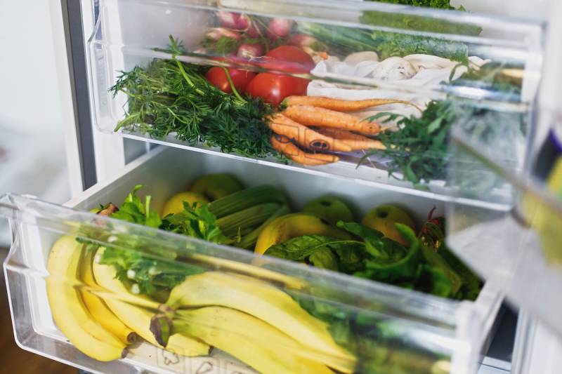 Open fridge filled with produce
