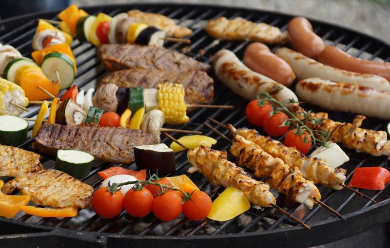 meat and veggies on a grill