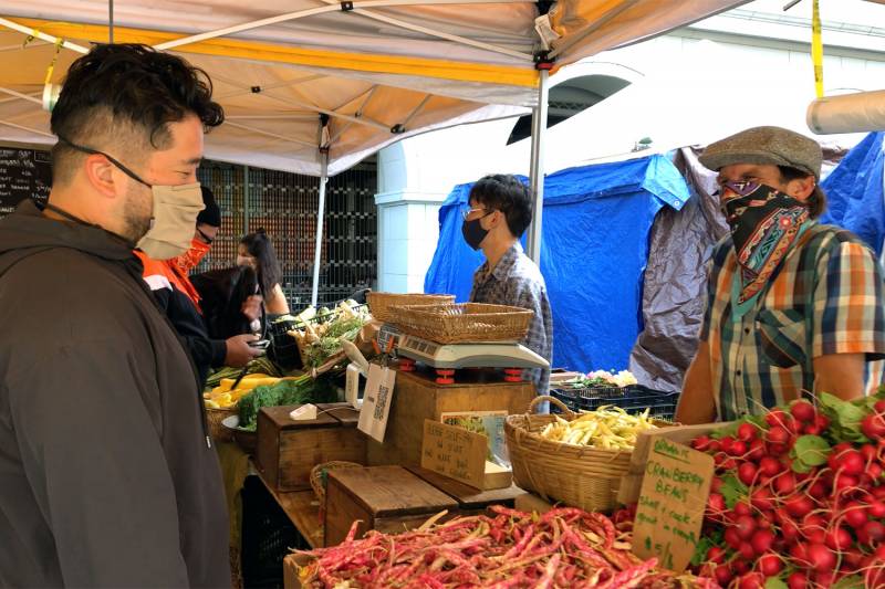 Brandon Jiu visiting Kenny Baker of Lonely Mountain Farm at the Ferry Plaza Farmers Market.